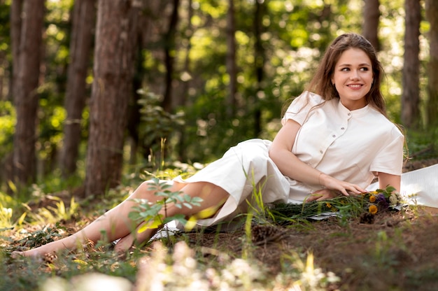 Full shot smiley woman posing in nature