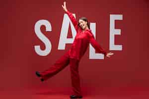 Free photo full shot smiley woman wearing red clothes