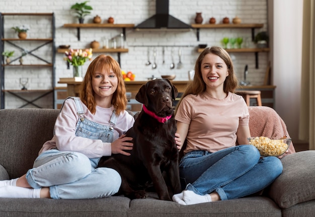 Full shot smiley women and dog