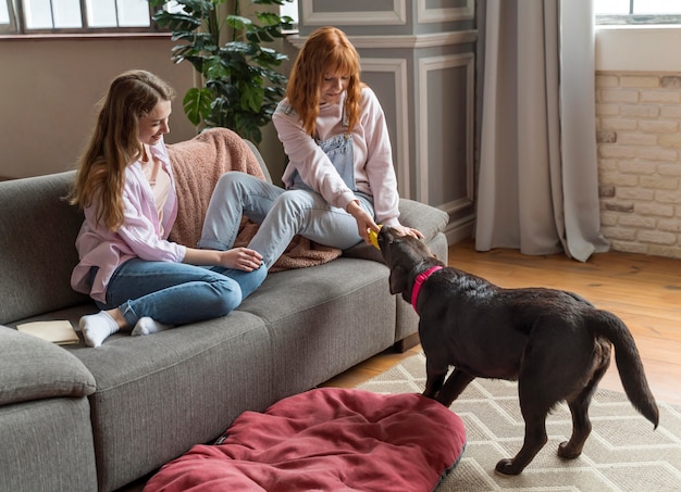 Full shot smiley women and dog