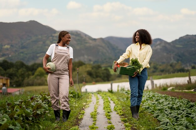 Full shot smiley women with harvest