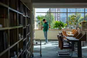 Free photo full shot student in library