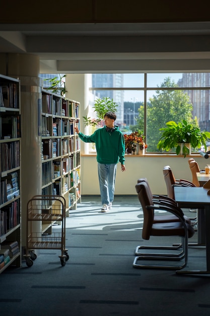 Free photo full shot student looking for books