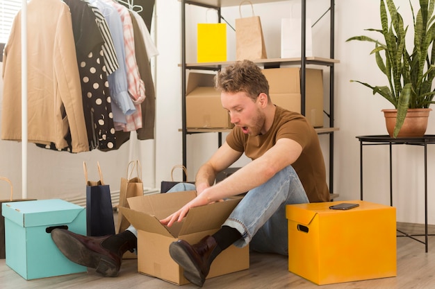 Full shot surprised man with box