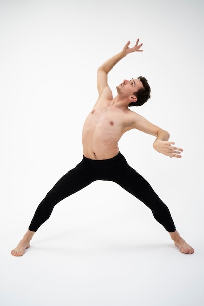 Full shot talented dancer performing  in studio