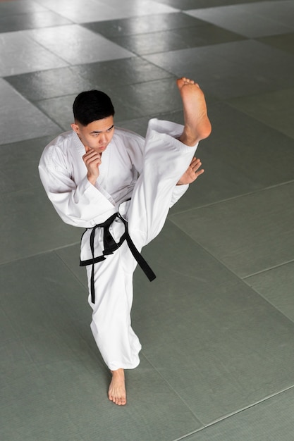 Free Photo full shot teen practicing taekwondo