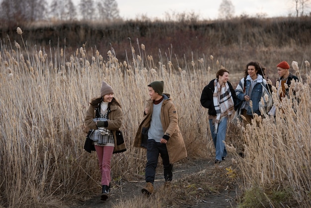 Full shot teenagers walking together