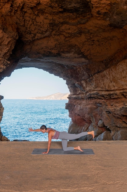 Full shot woman exercising with view