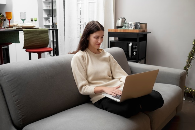 Full shot woman holding device