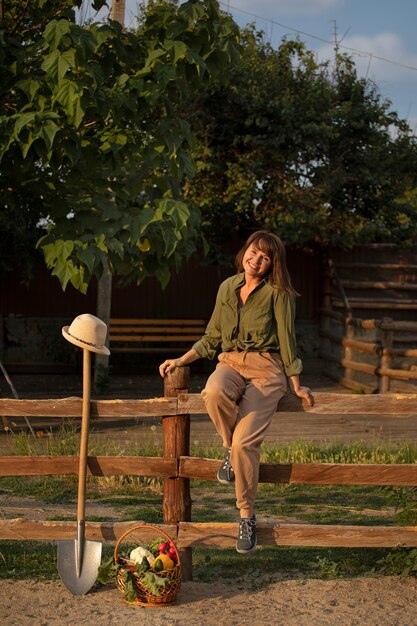 Full shot woman living at farmhouse