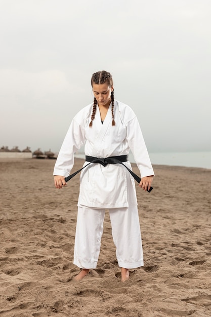 Free Photo full shot woman in martial arts outfit