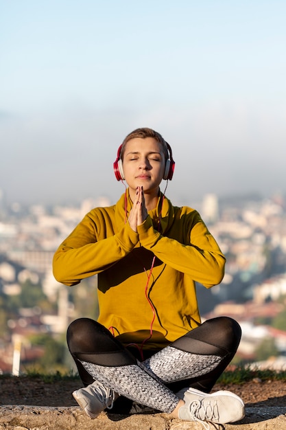 Full shot of woman meditating