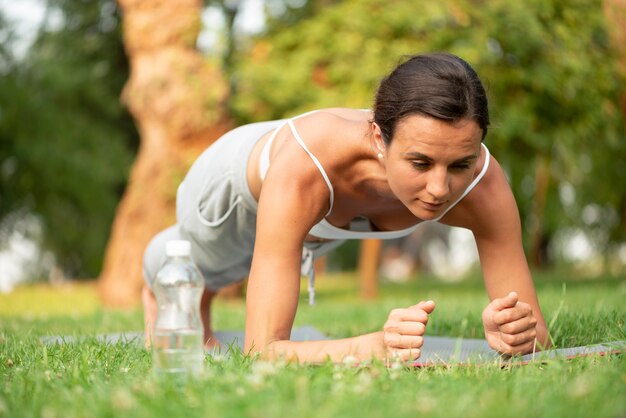 Full shot woman plank workout