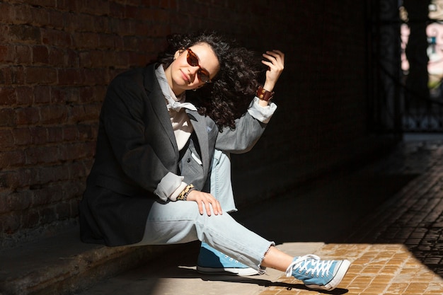 Full shot woman posing outdoors