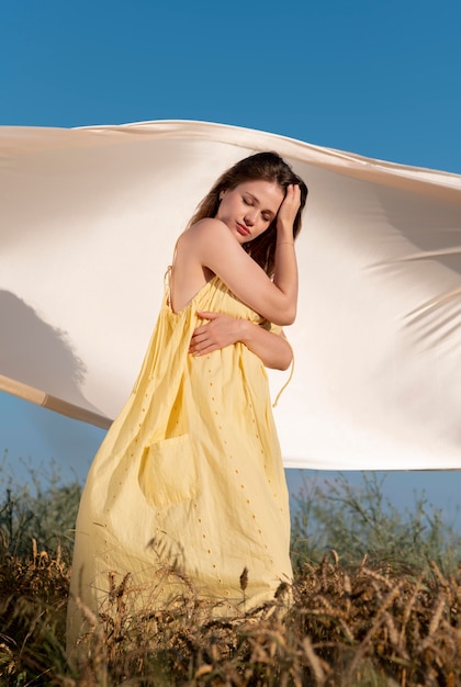 Free Photo full shot woman posing with closed eyes