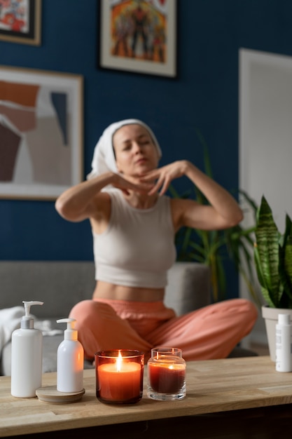 Full shot woman practicing facial yoga