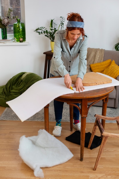 Free Photo full shot woman restoring furniture