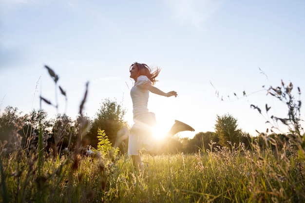 Full shot woman running outdoors