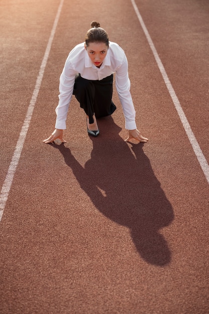 Free Photo full shot woman running in suit