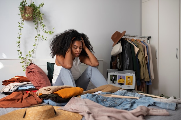 Full shot woman sitting in bed