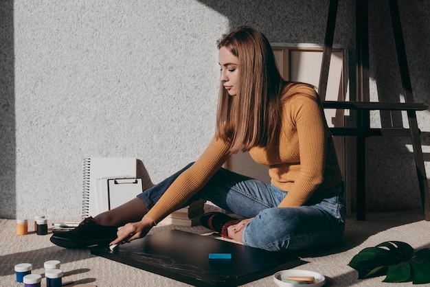 Full shot woman sitting on floor