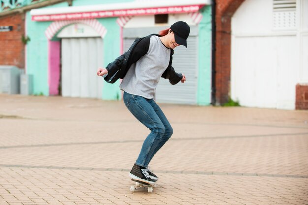 Full shot woman on skateboard