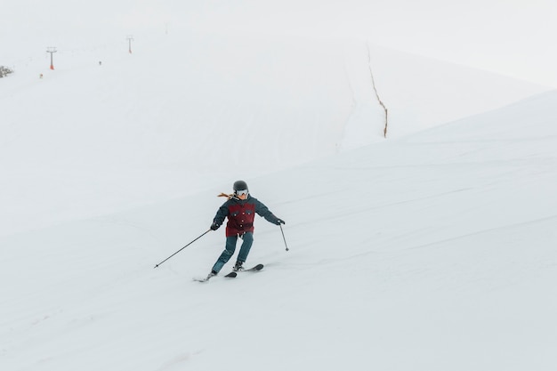 Free photo full shot woman skiing