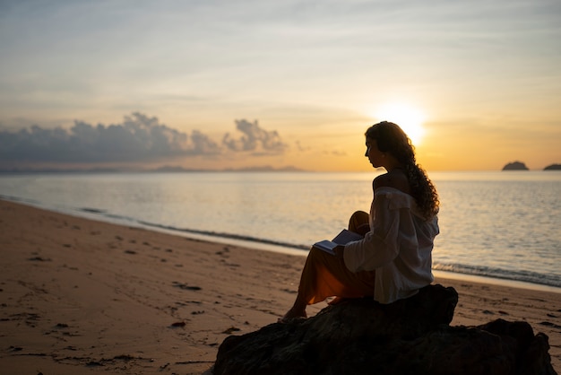 Free Photo full shot woman spending a day alone on the beach