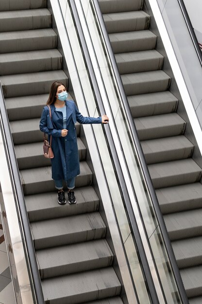 Full shot woman on stairs