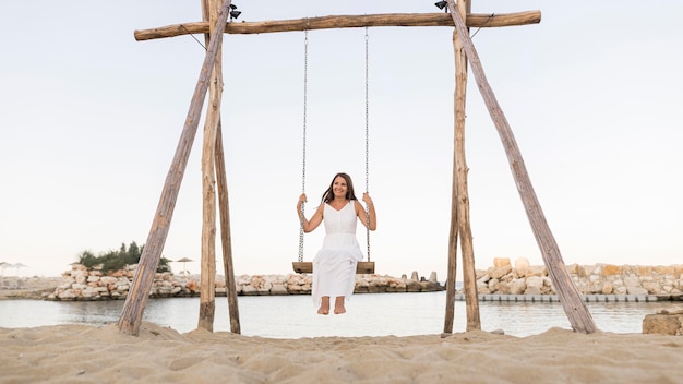 Free photo full shot woman in swing