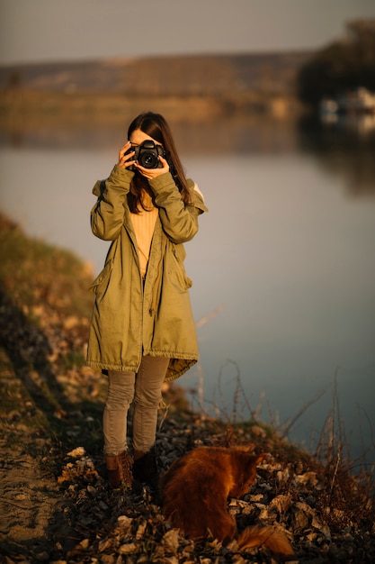 Free Photo full shot woman taking photo