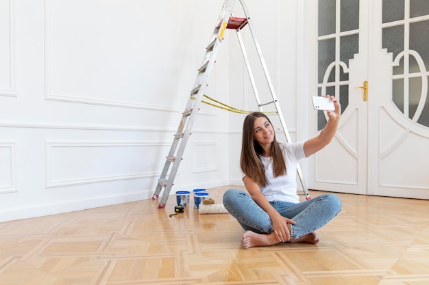 Full shot woman taking selfie