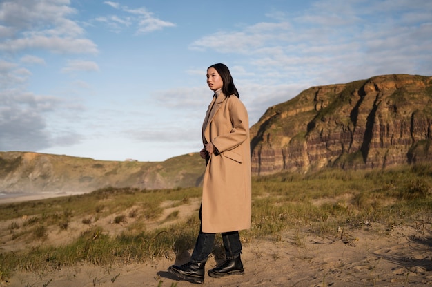 Free photo full shot woman taking a walk in nature