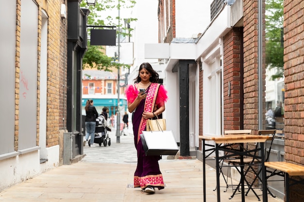 Full shot woman walking with shopping bags