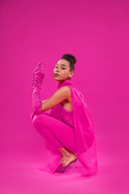 Free Photo full shot woman wearing full pink outfit