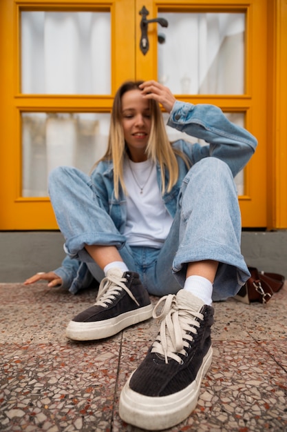 Free photo full shot woman wearing total denim outfit