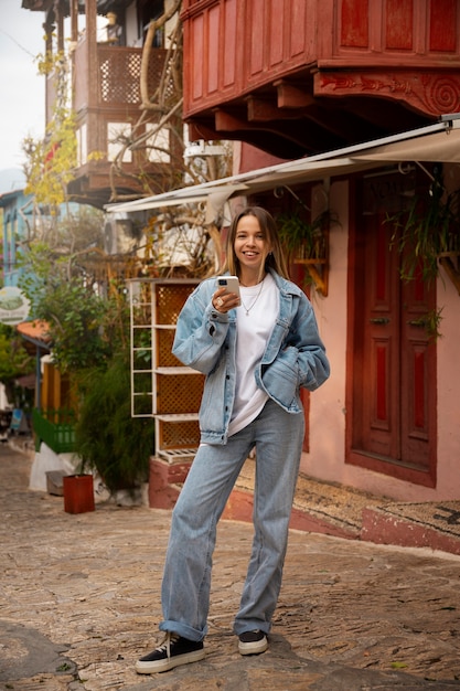 Free Photo full shot woman wearing total denim outfit