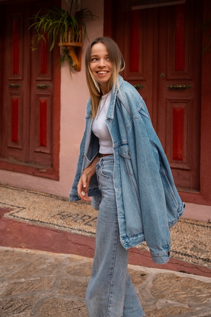 Free photo full shot woman wearing total denim outfit