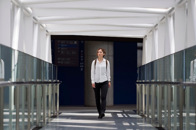 Free photo full shot woman with backpack