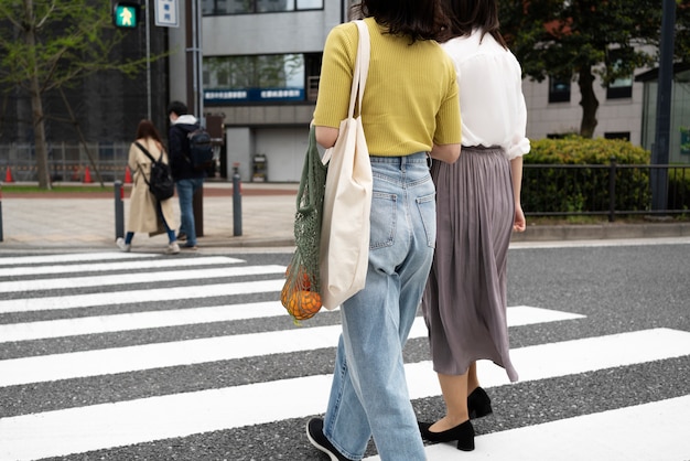 Full shot woman with fabric bag