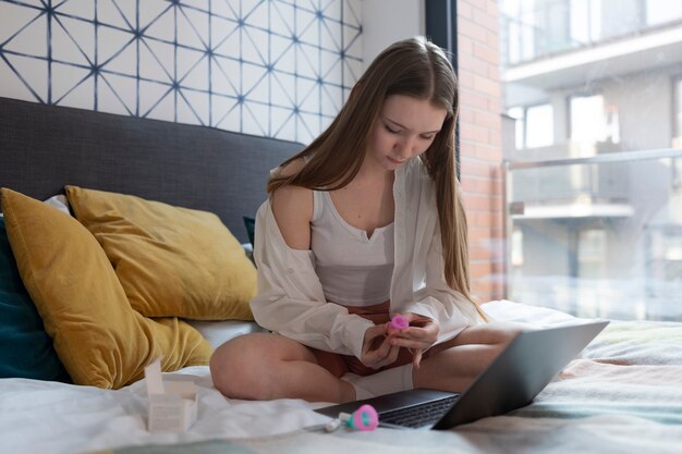 Full shot woman with menstrual products