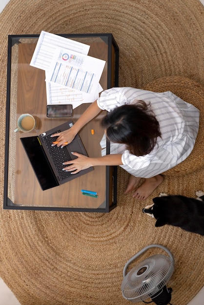 Free photo full shot woman working remotely