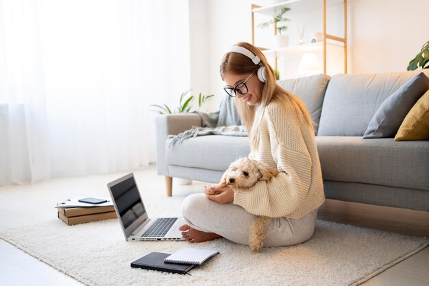 Full shot woman working with dog