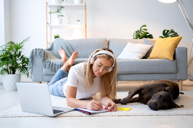 Free Photo full shot woman working with headphones