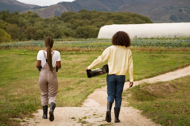 Full shot women at countryside