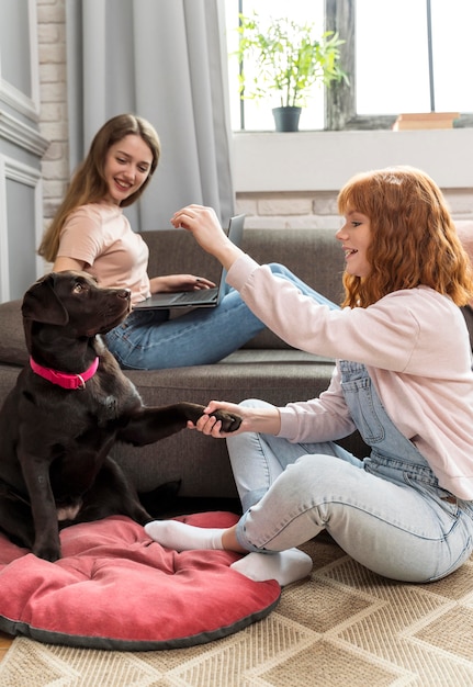 Full shot women and cute dog