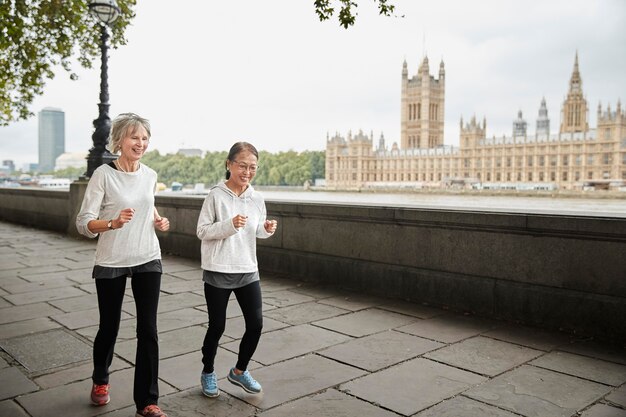 Full shot women running outdoors