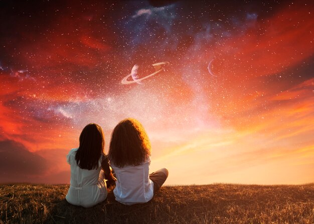 Full shot women sitting on meadow