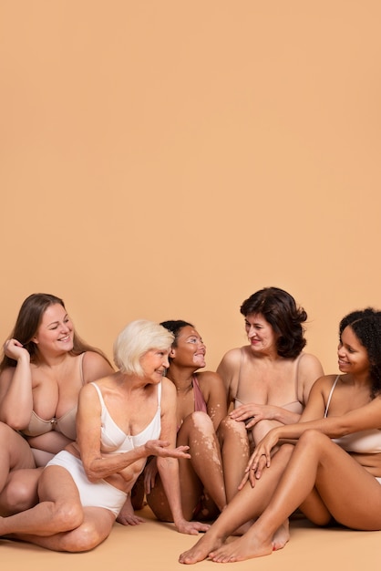 Free photo full shot women sitting together