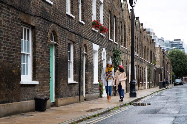 Full shot women walking in city